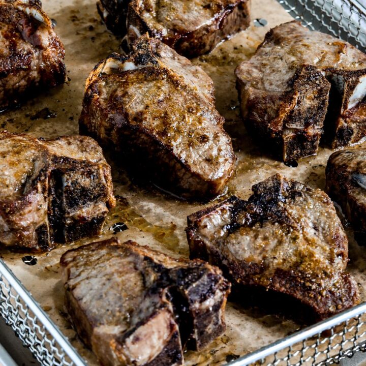 Air Fryer Lamb Chops shown in Air Fryer basket.