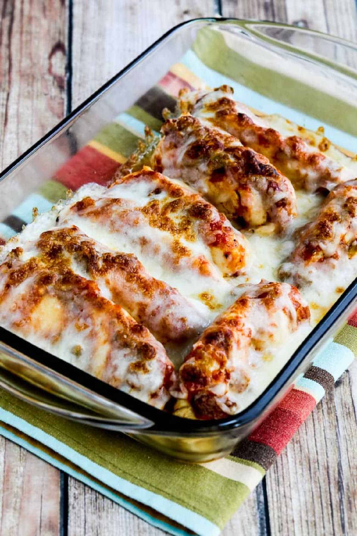 Instant Pot Salsa Chicken in baking dish on striped napkin