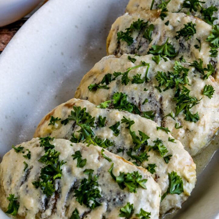 Janet's Easy Mustard Chicken shown on serving platter with parsley garnish.