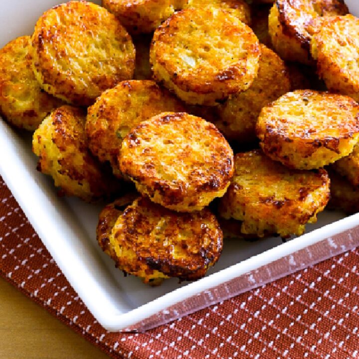 Easy Baked Cauliflower Tots in square bowl on rust colored napkin