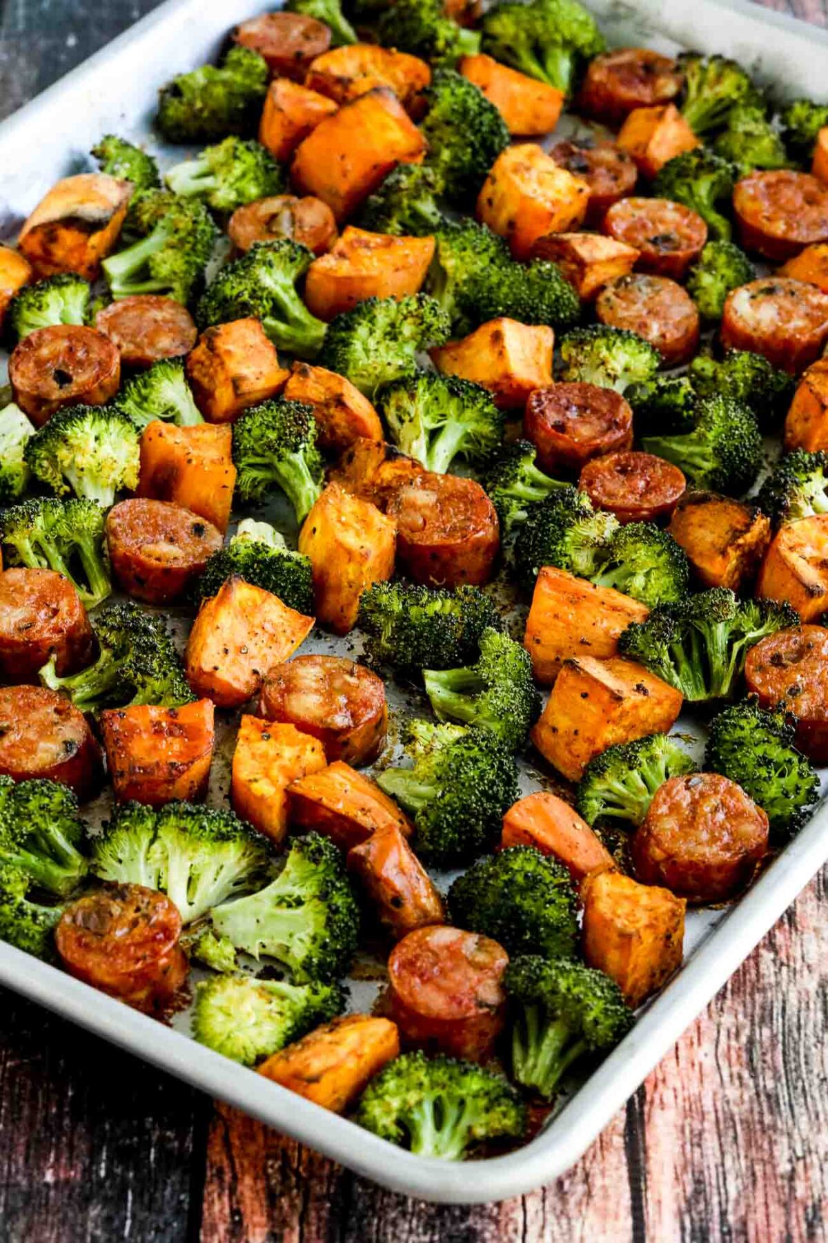 Roasted Sweet Potatoes, Sausage, and Broccoli Sheet Pan Meal shown on sheet pan