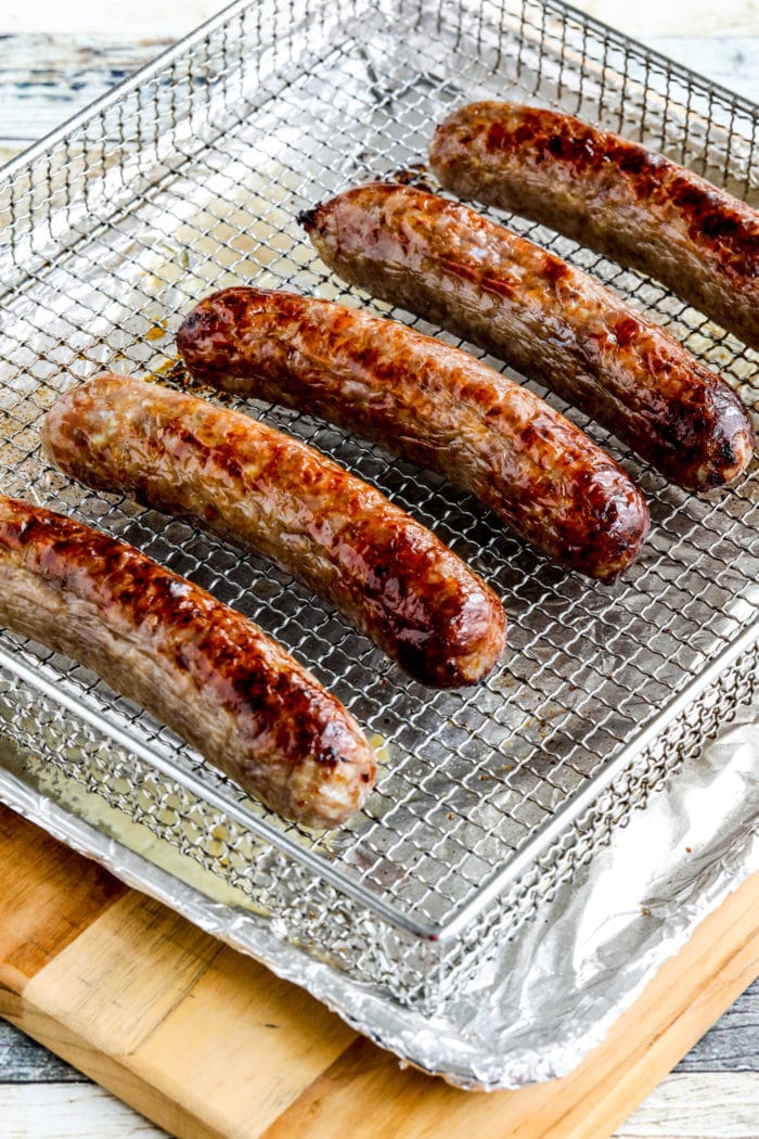 finished Air Fryer Brats shown in Air Fryer basket