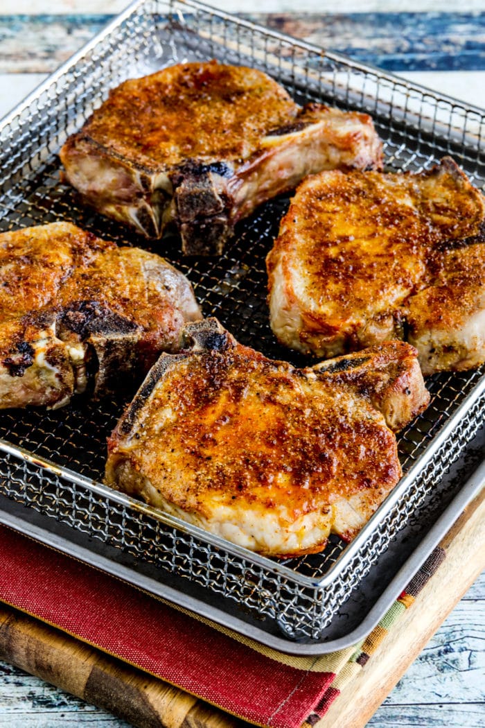 Air Fryer Pork Chops shown in Air Fryer basket