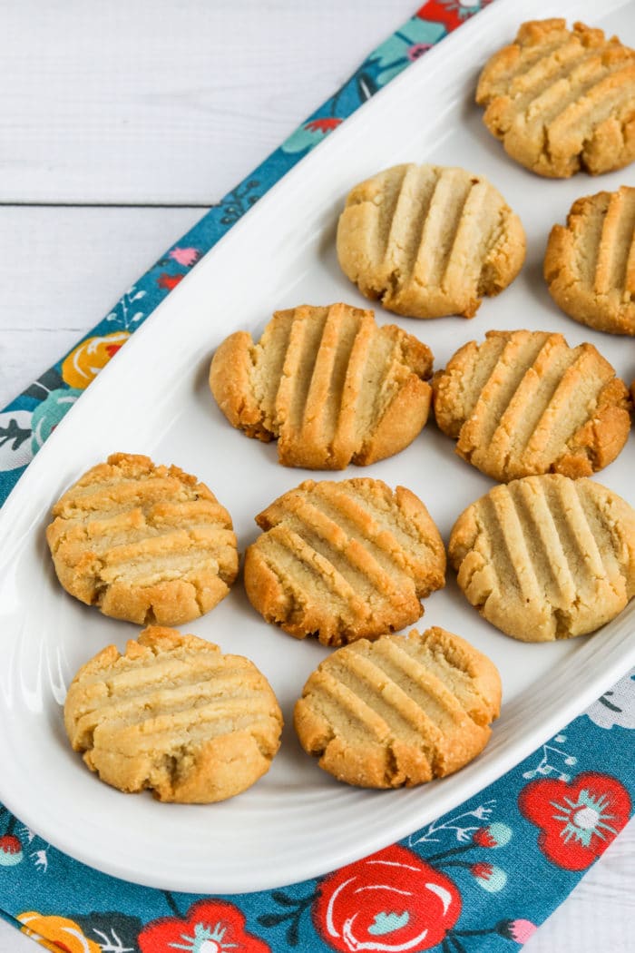 Almond Flour Shortbread Cookies on plates with blue napkin in back