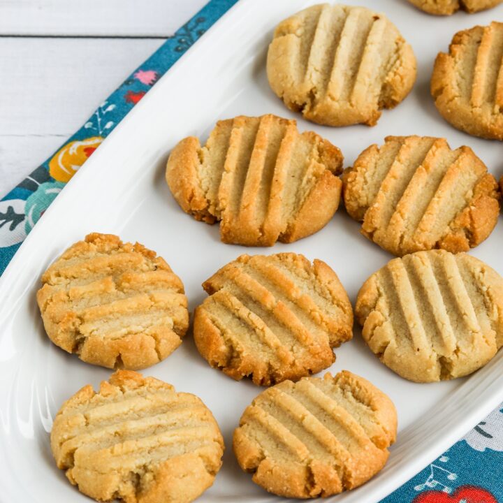 Almond Flour Shortbread Cookies on plates with blue napkin in back