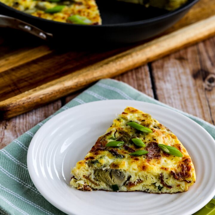 Artichoke Frittata with Bacon one slice on plate and frittata pan in background