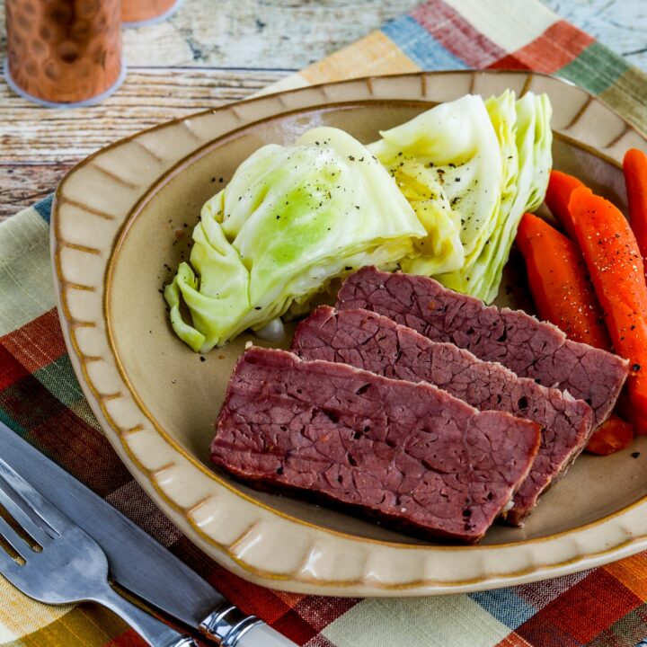 Slow Cooker Corned Beef on plate with cabbage and carrots