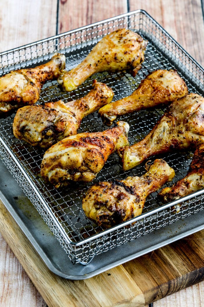 Air Fryer Chicken Drumsticks shown in air fryer basket