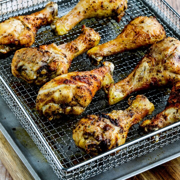 Air Fryer Chicken Drumsticks shown in air fryer basket