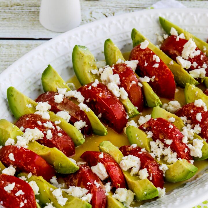 Close-up of Avocado Tomato Salad on serving plate with crumbled Feta