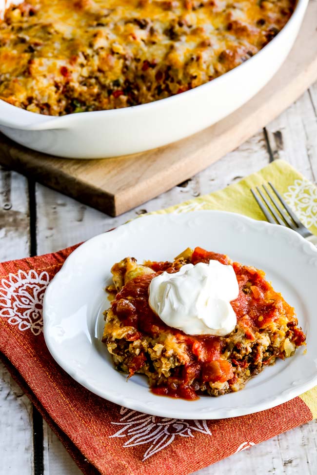 Cheesy Low-Carb Taco Casserole finished casserole and one serving on plate