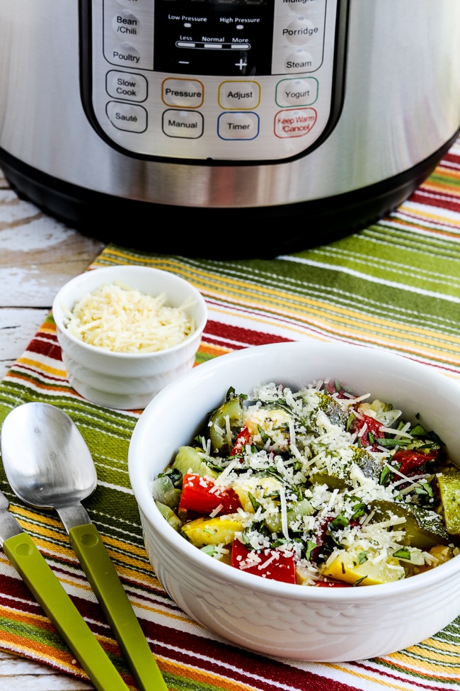 Instant Pot Ratatouille finished dish in serving bowl with Instant Pot in back