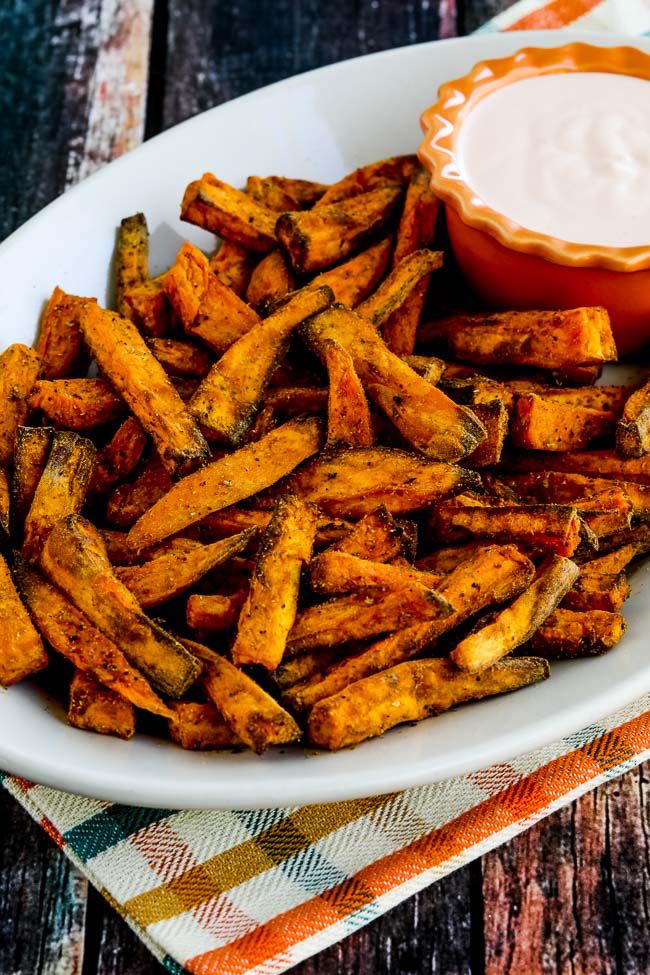 Air Fryer Sweet Potato Fries on platter with Sriracha Dipping Sauce