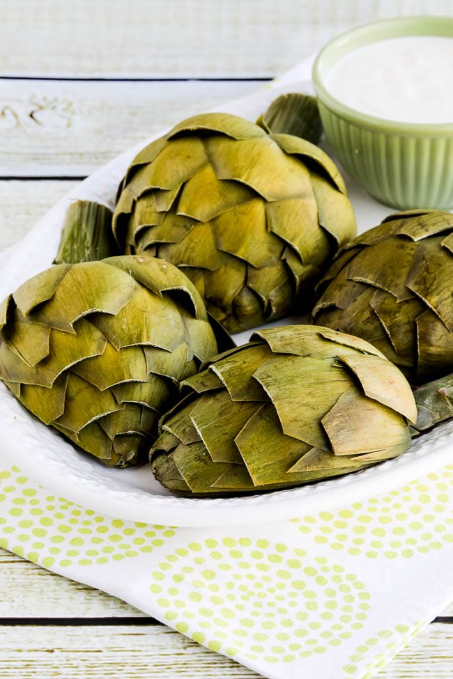 Mom's Artichokes and Artichoke Dipping Sauce shown on serving plate