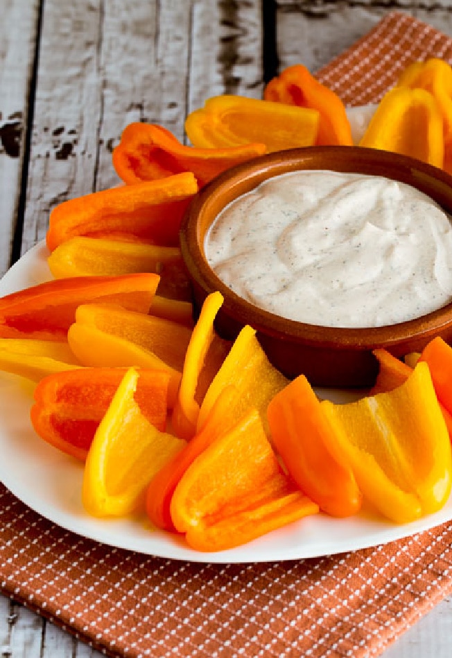 Southwestern Ranch Dip on serving plate with sweet mini-pepper scoops