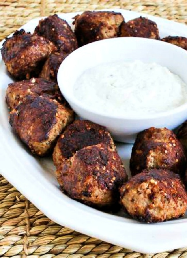 Turkey Parmesan Meatballs on serving platter with sauce.