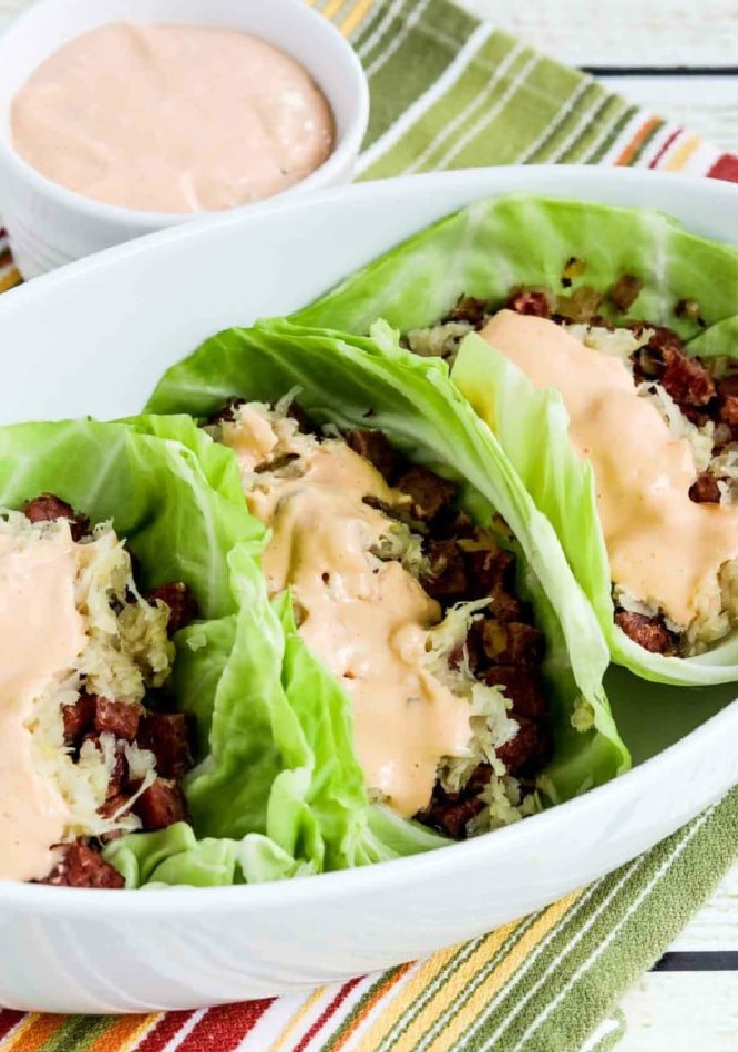 Reuben Sandwich Cabbage Cups shown in serving dish with thousand island dressing