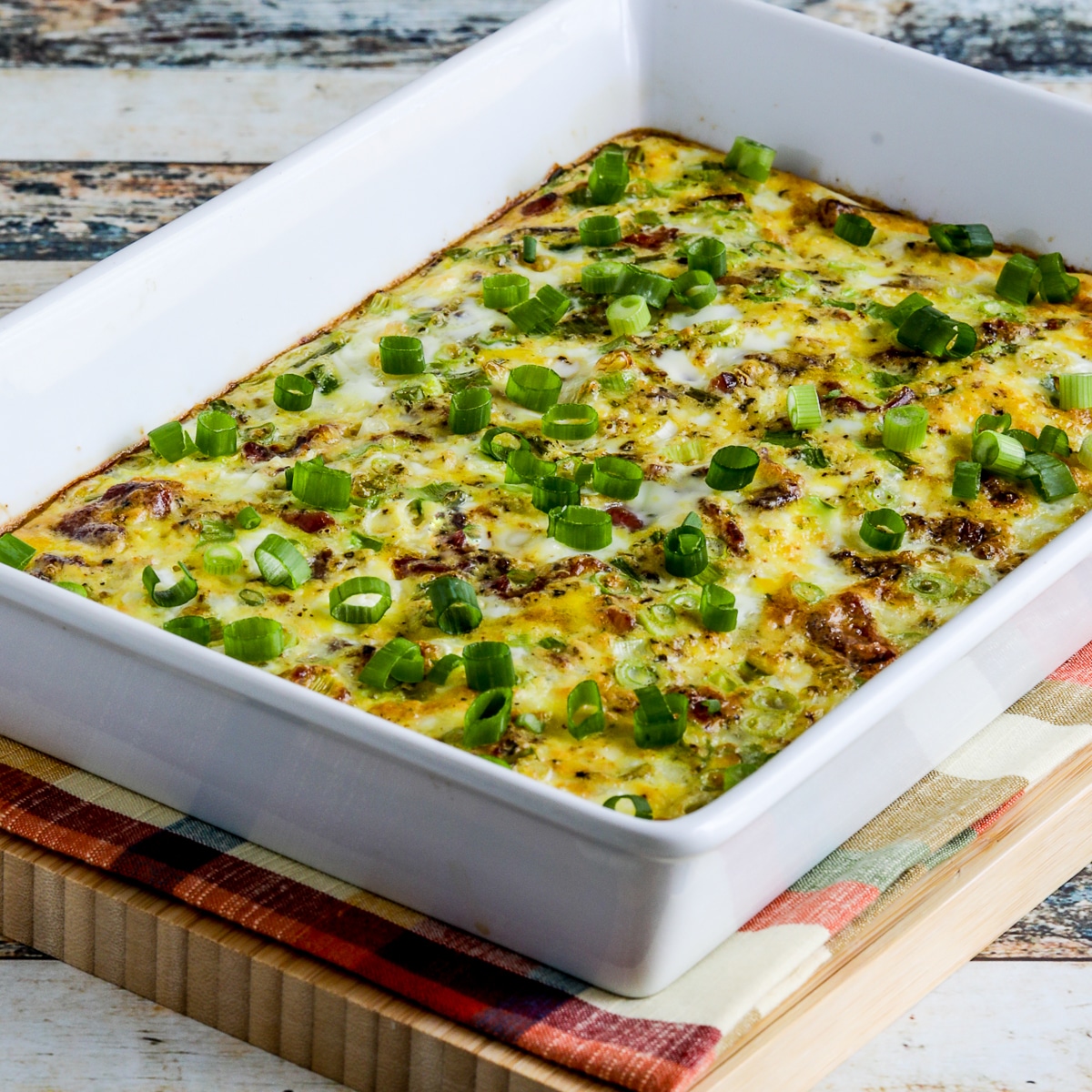 Square image of Bacon Feta Breakfast Casserole in baking dish