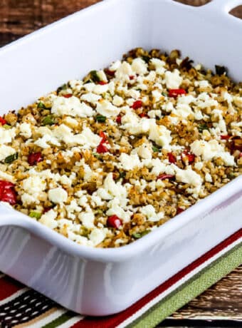 Square image of Greek Cauliflower Rice Bake shown in baking dish.