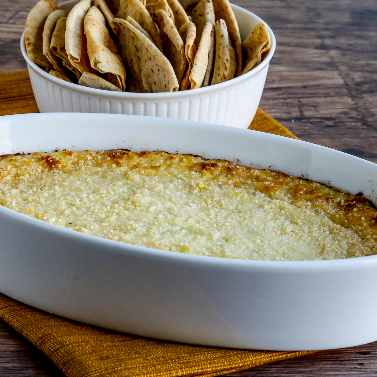 Square image for Hot Artichoke Dip with Peperoncini shown with low-carb pita bread.