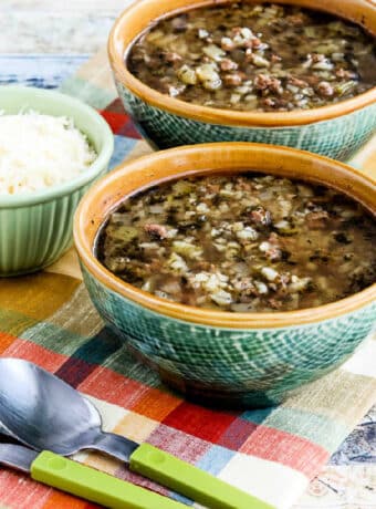 Square image for Instant Pot Ground Beef Cauliflower Soup in two bowls with Parmesan on the side.