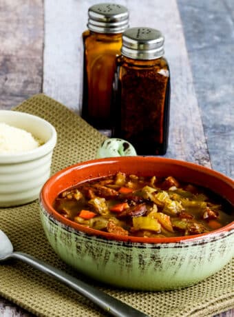 Sausage and Cabbage Soup shown in bowl with spoon.