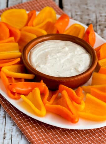 Southwestern Ranch Dip on large serving plate with mini-pepper scoops.