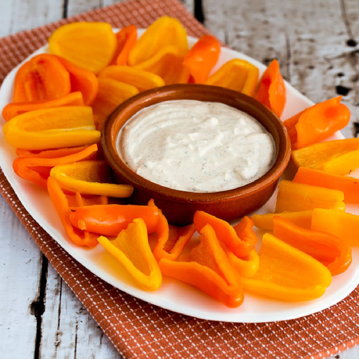 Southwestern Ranch Dip on large serving plate with mini-pepper scoops.