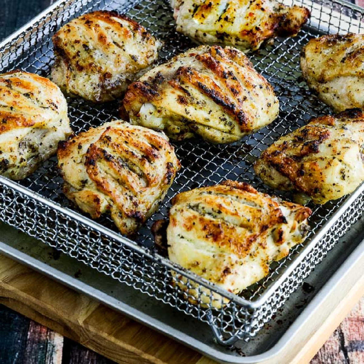 Herb-Marinated Air Fryer Chicken Thighs shown in Air Fryer basket