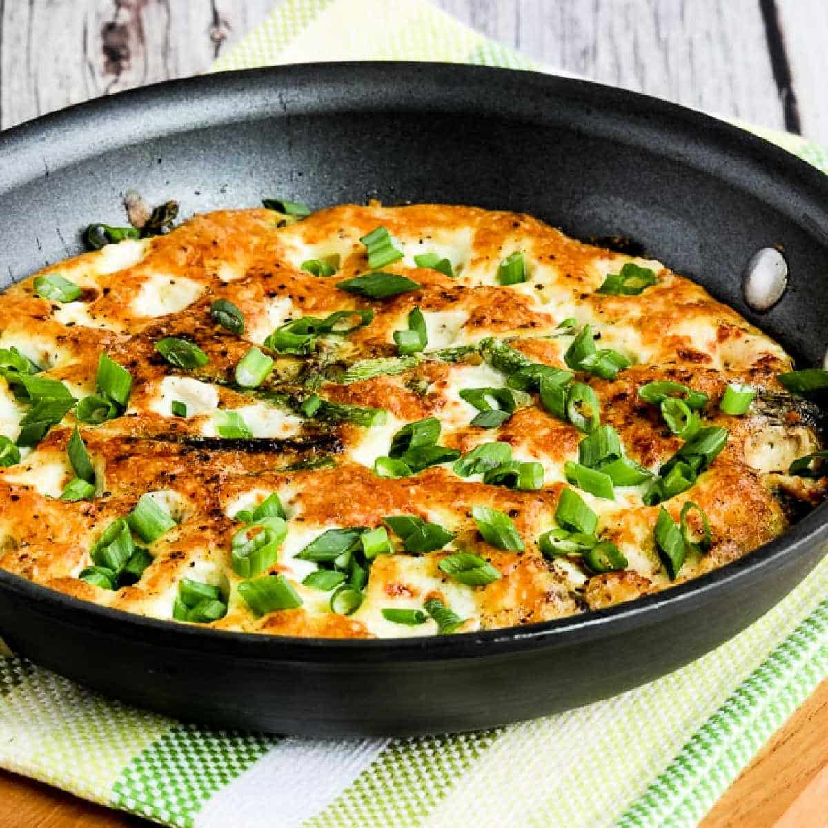 Asparagus Frittata with Fresh Mozzarella shown in frying pan.