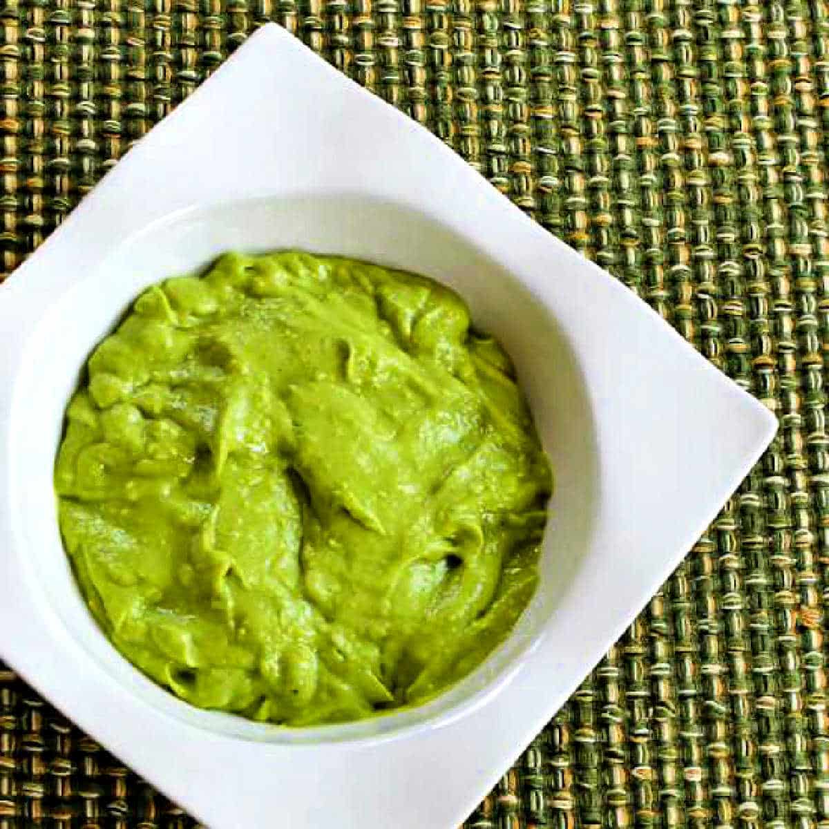 Square image for Easy Avocado Sauce in white serving bowl.