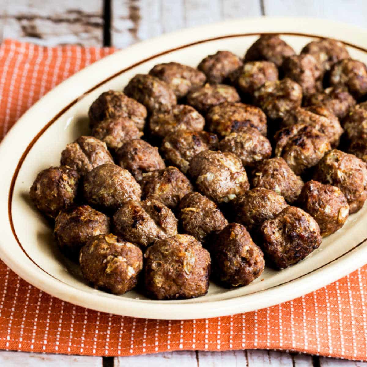 Baked Swedish Meatballs shown on serving platter.