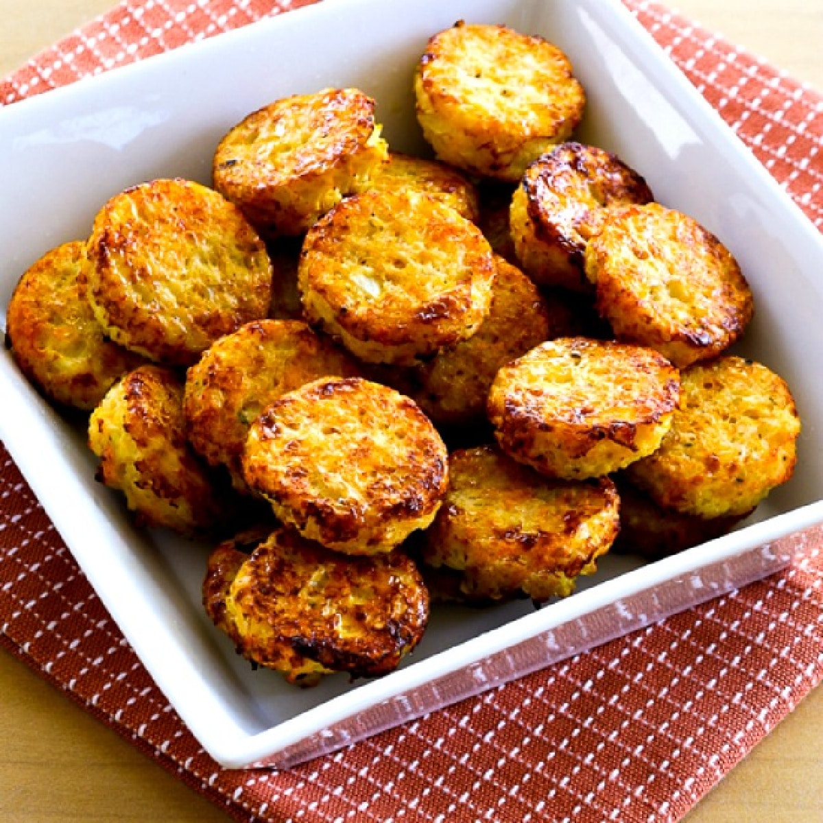 square image of Cheesy Baked Cauliflower Tots on napkin