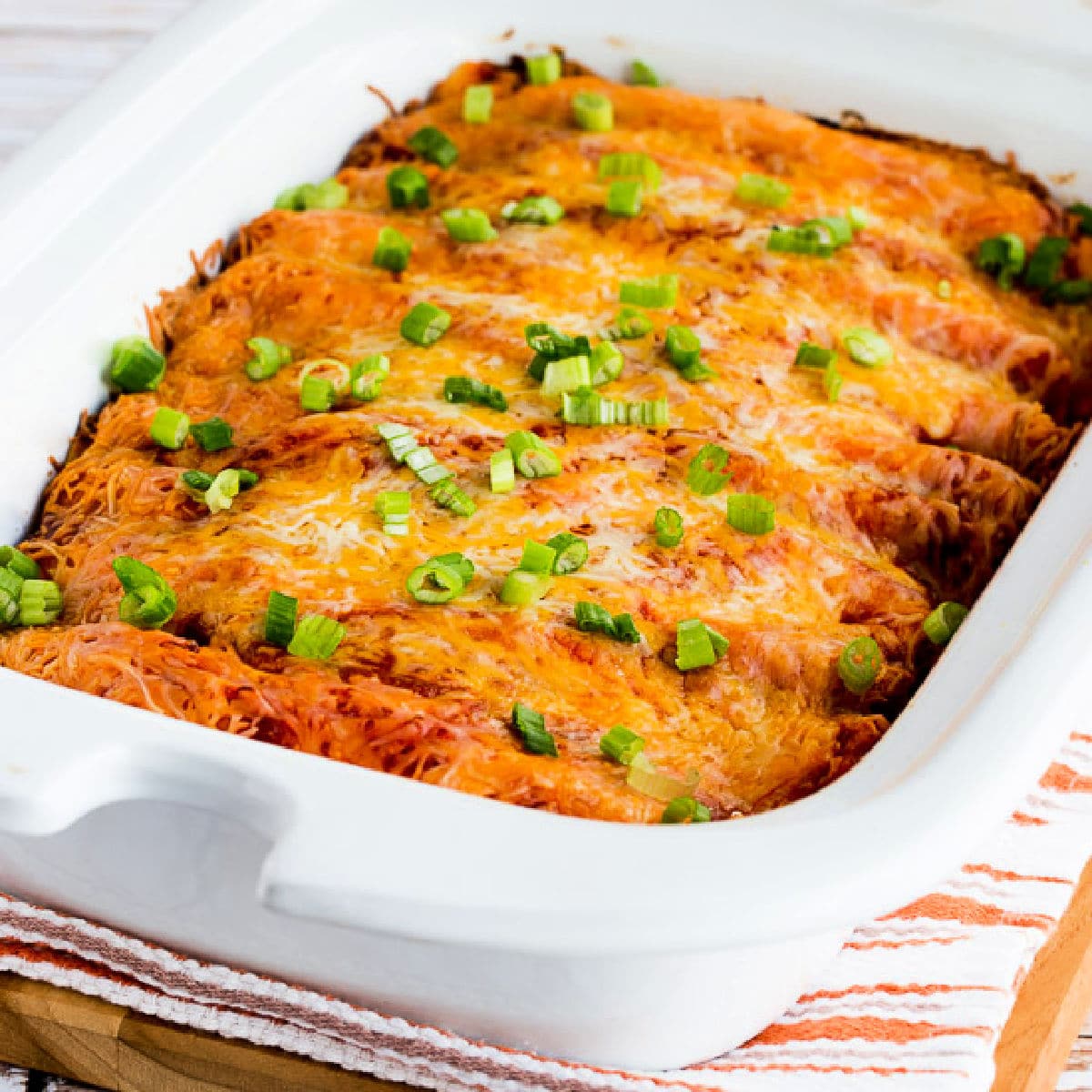 Square image for Slow Cooker Sour Cream Chicken Enchiladas shown in Casserole Crock-Pot.