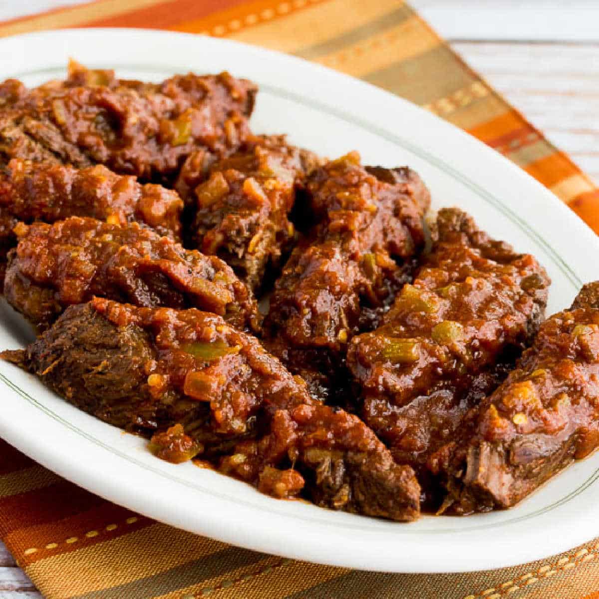 Square image of Slow Cooker Southwestern Pot Roast on serving plate.