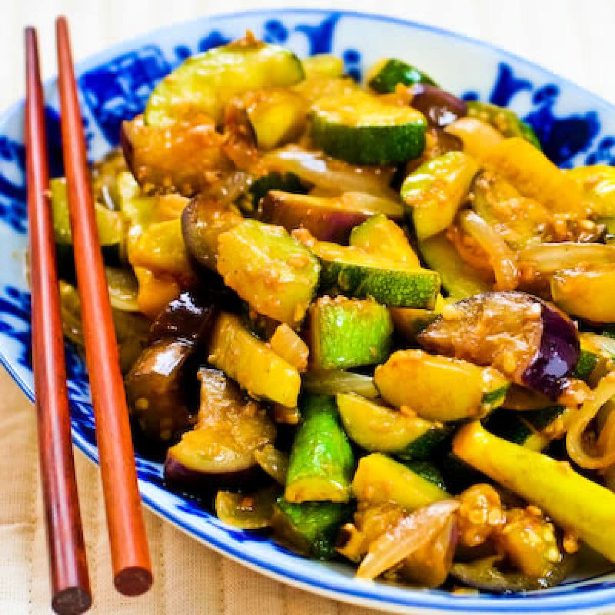 Garlic Lover's Vegetable Stir Fry shown on serving plate with chopsticks.