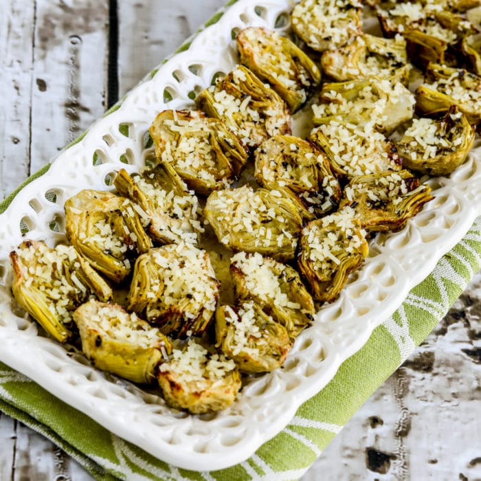 Air Fryer Artichoke Hearts, thumbnail image of roasted artichoke hearts on serving plate