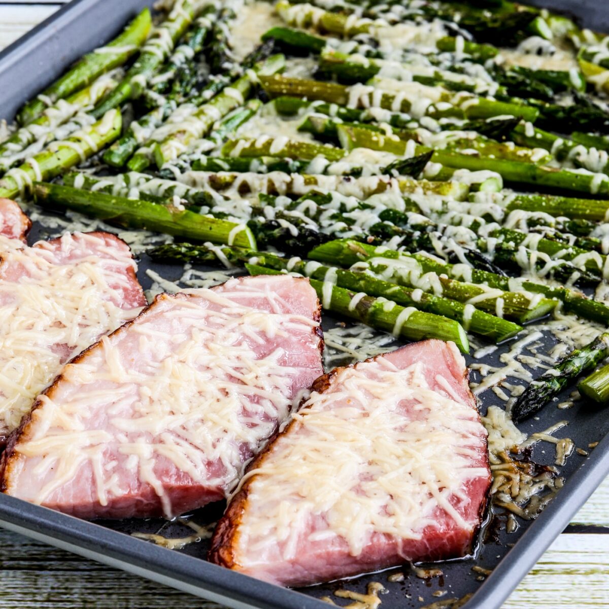 Easy Cheesy Baked Ham and Asparagus square thumbnail image of finished meal on sheet pan