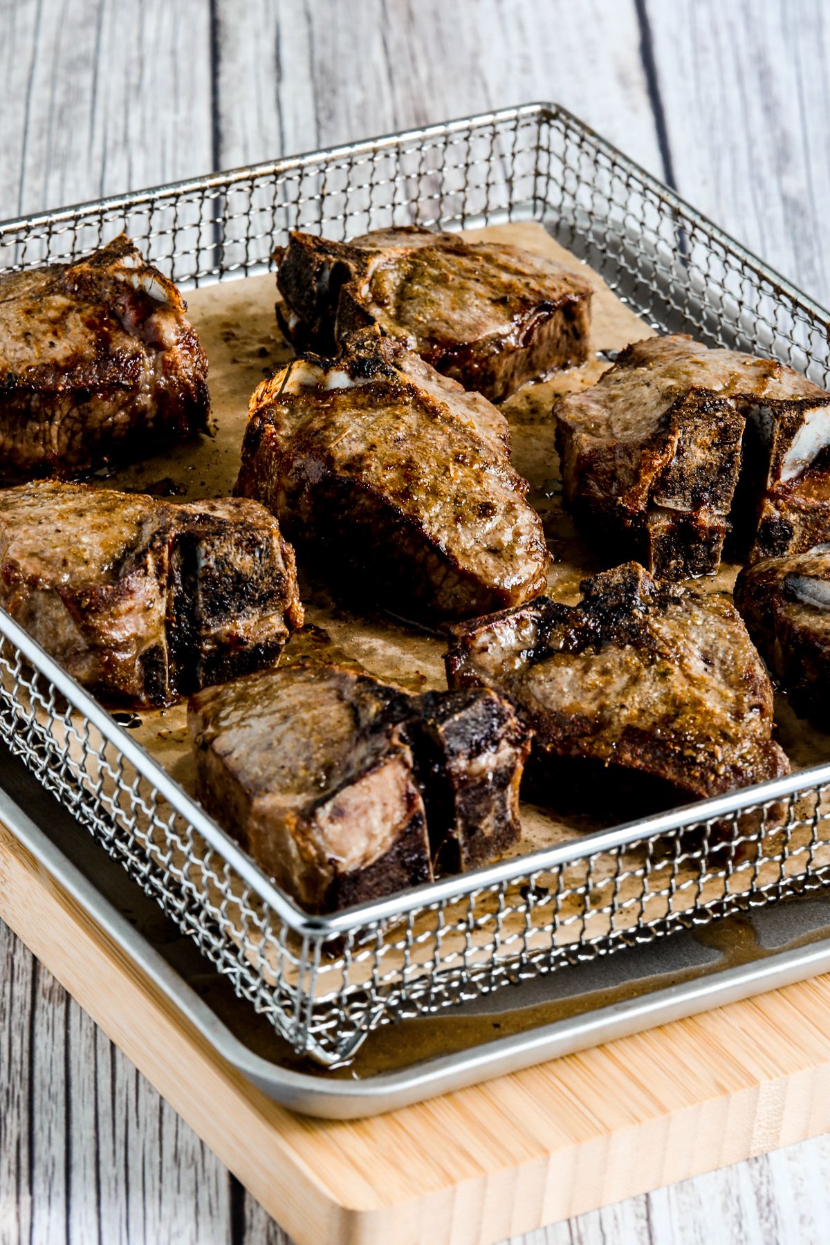 More distant photo of Lamb Chops in Air Fryer basket.