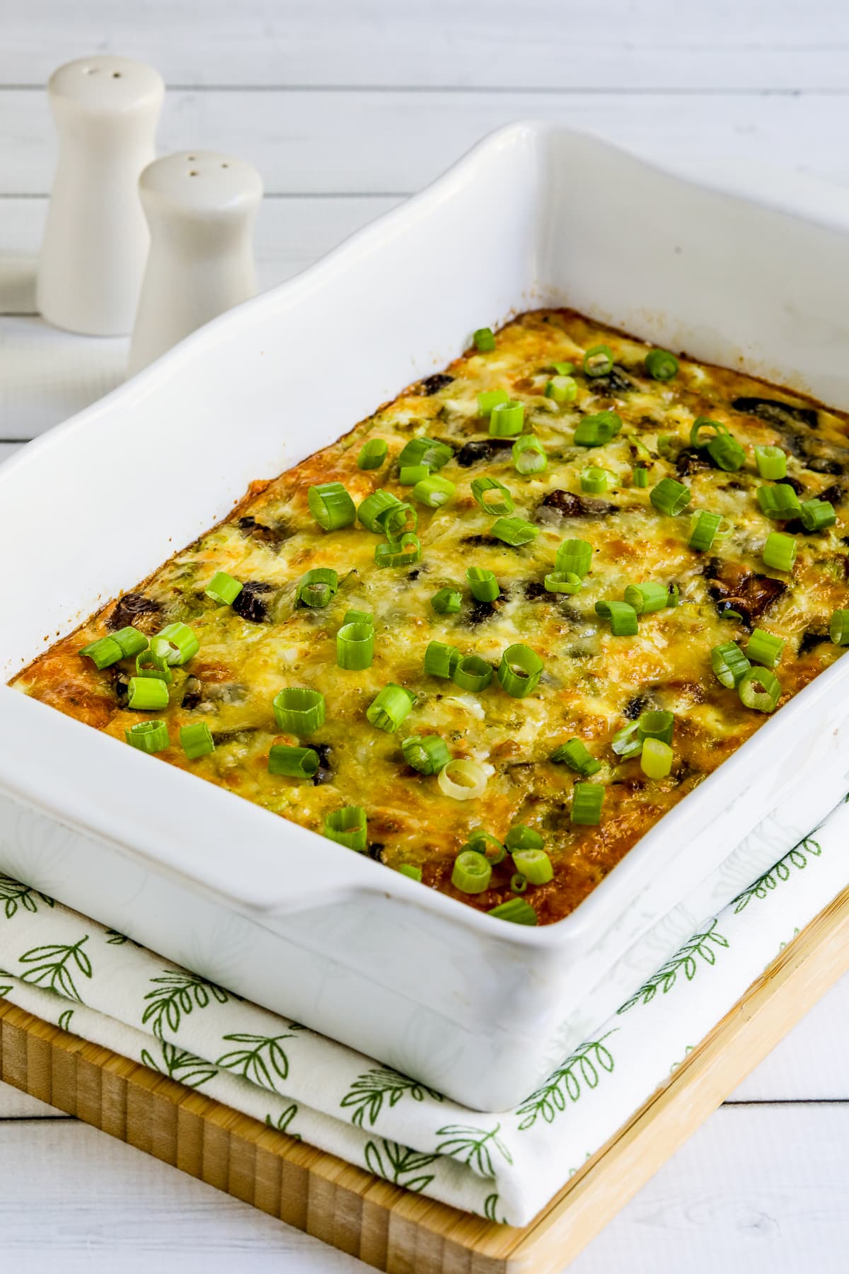 Cheesy Vegetarian Breakfast Casserole shown in baking dish, vertical image.