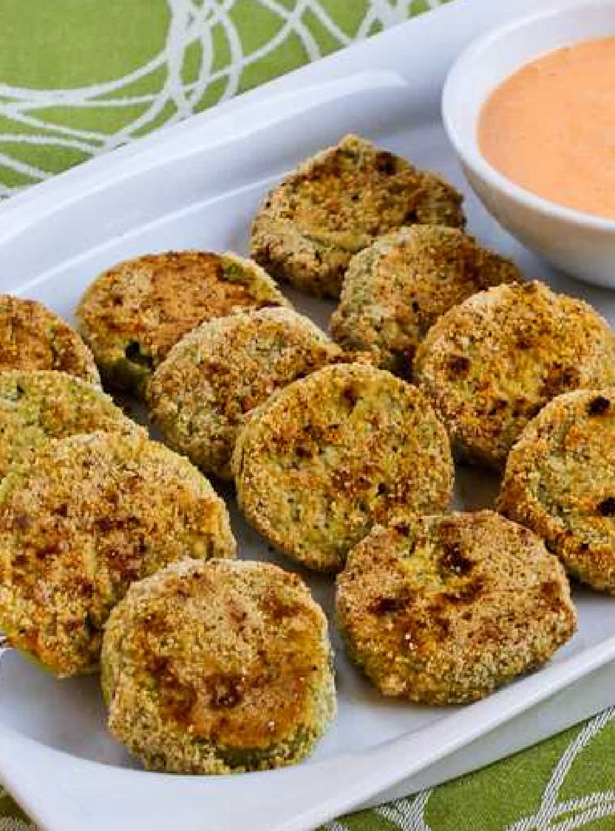 Oven-Fried Green Tomatoes with Sriracha-Ranch Dipping Sauce shown on serving plate