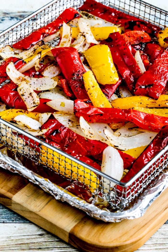 finished Air Fryer Peppers and Onions in Air Fryer basket