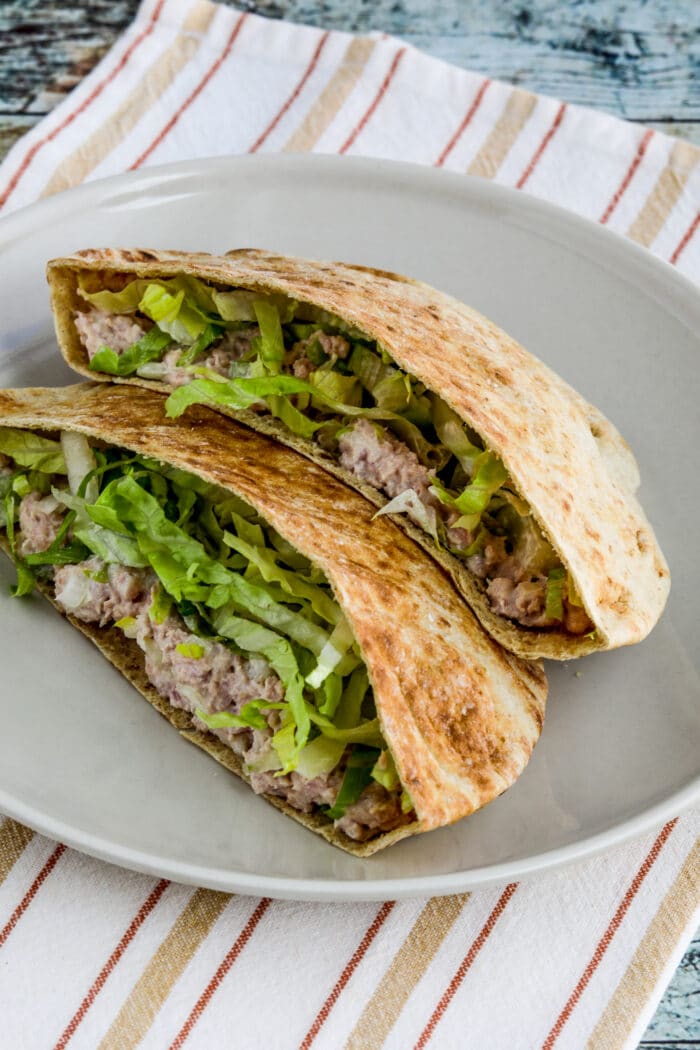 deviled ham in pita bread, shown on serving plate with napkin