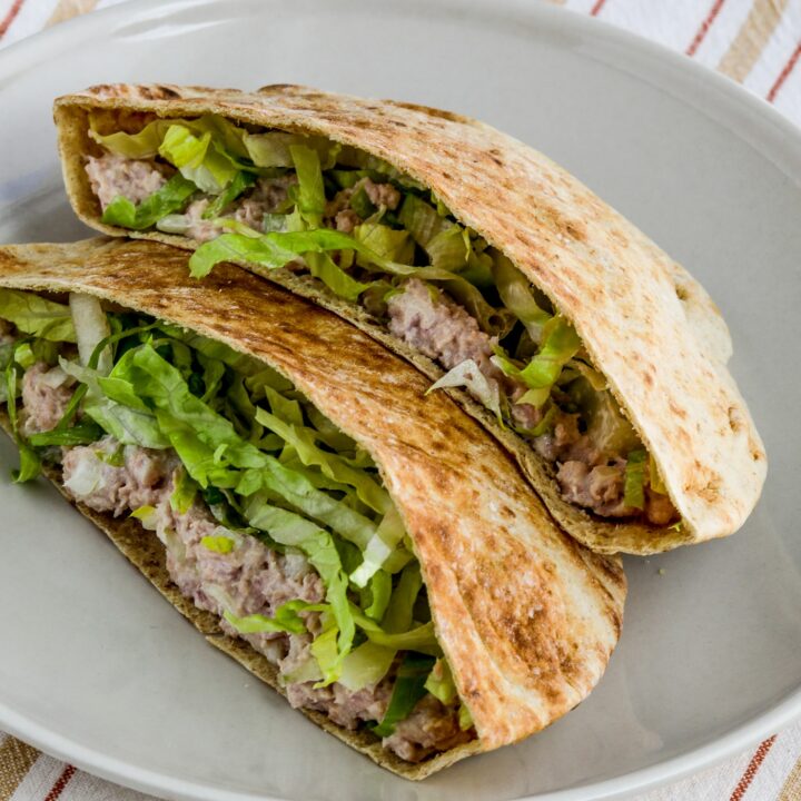 deviled ham in pita bread, shown on serving plate with napkin