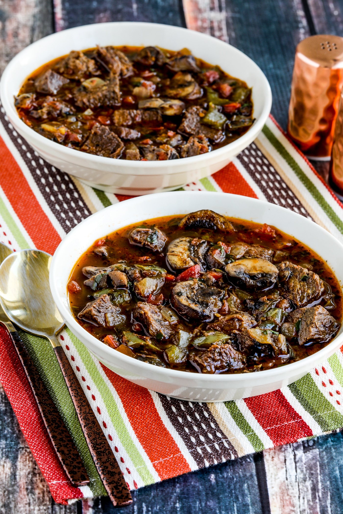 Leftover Roast Beef Italian Stew in two serving bowls with spoons