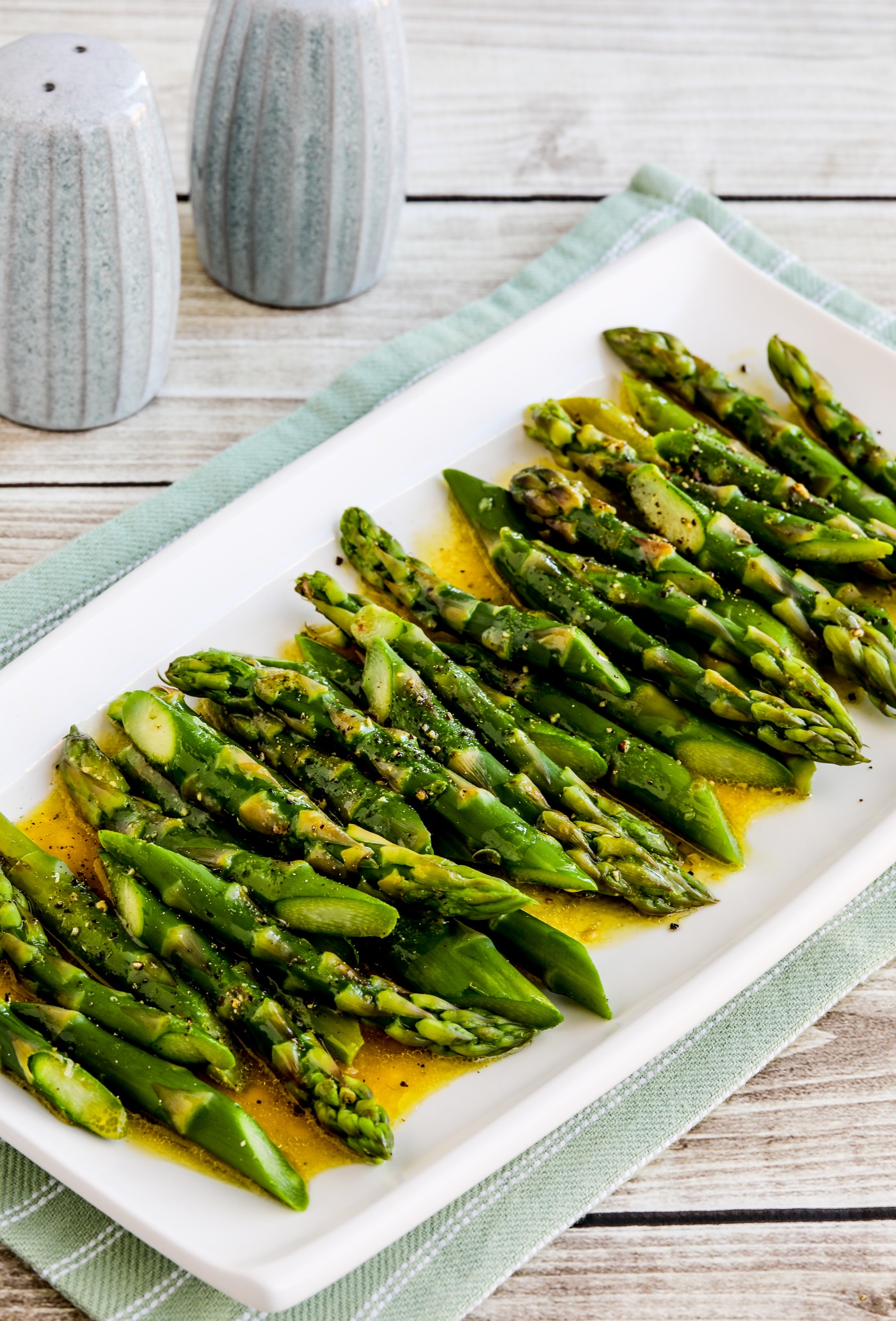 Barely-Cooked Asparagus with Lemon-Mustard Vinaigrette close-up photo of finished asparagus on serving plate