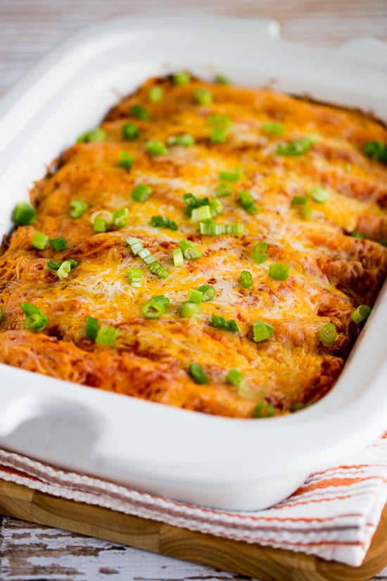 Slow Cooker Sour Cream Chicken Enchiladas shown in Casserole Crock Pot