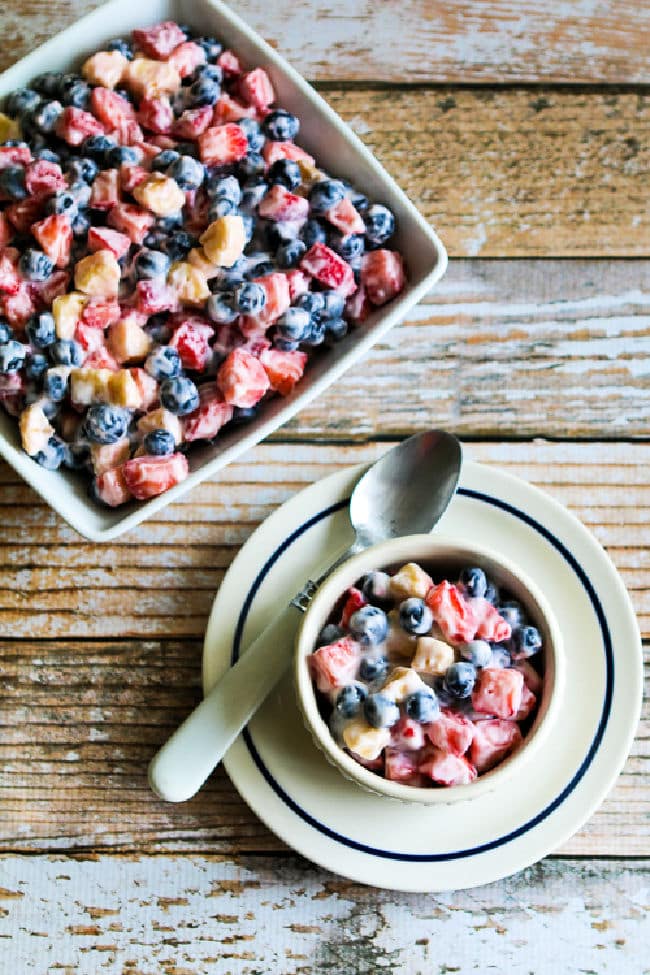 Red White and Blue Salad with one serving in bowl and salad in square dish.