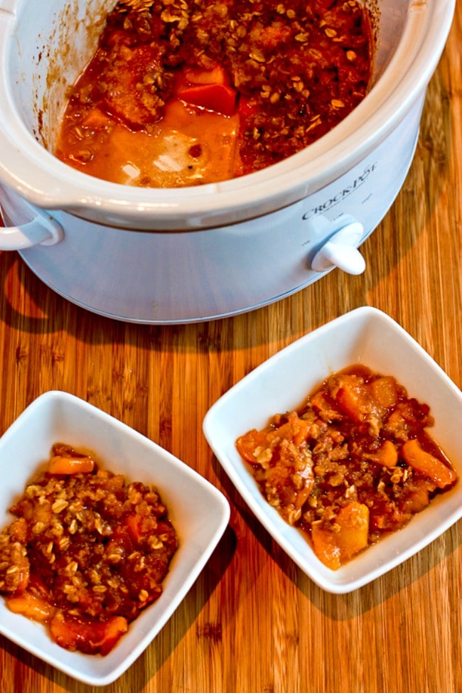 Slow Cooker Peach Crisp finished peach crisp in slow cooker and in two bowls