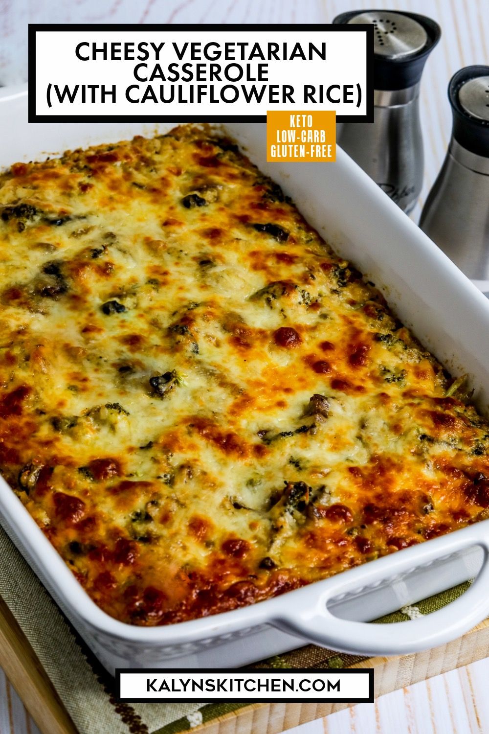 Pinterest image for Cheesy Vegetarian Casserole (with Cauliflower Rice) shown in baking dish with salt and pepper in back.